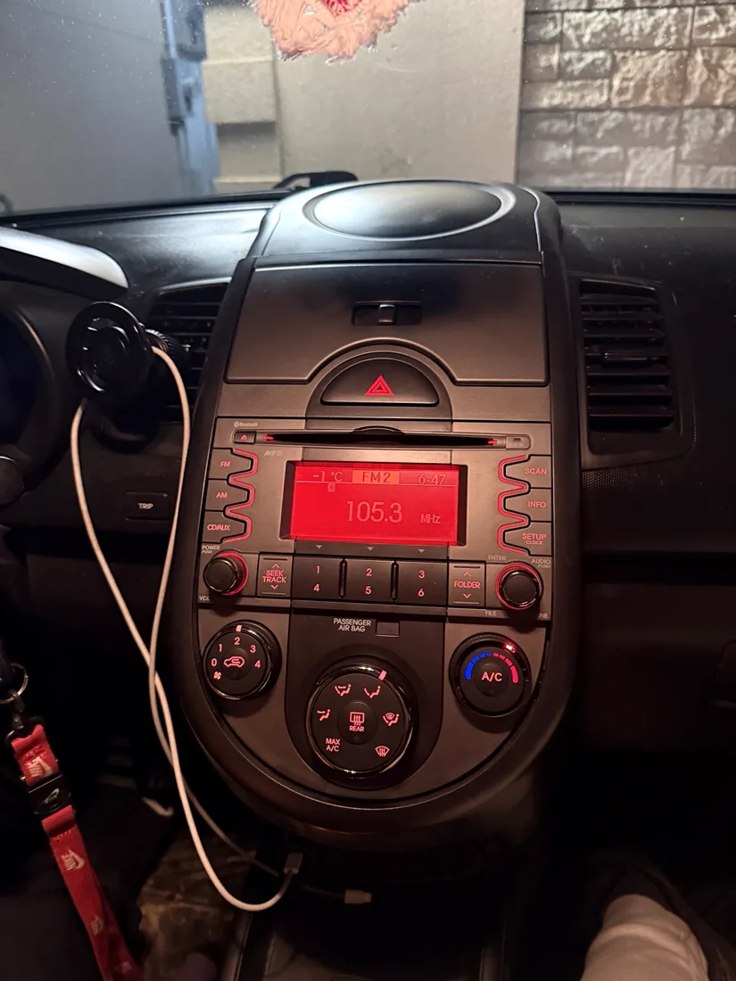 Before: original factory radio in dashboard